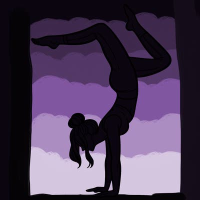 a woman doing a handstand