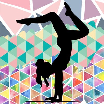 a woman doing a handstand