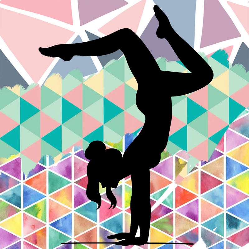 a woman doing a handstand