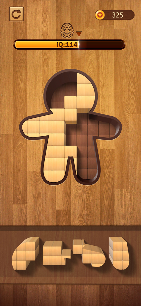 A wooden block puzzle level featuring a gingerbread man shape and brain training progress.