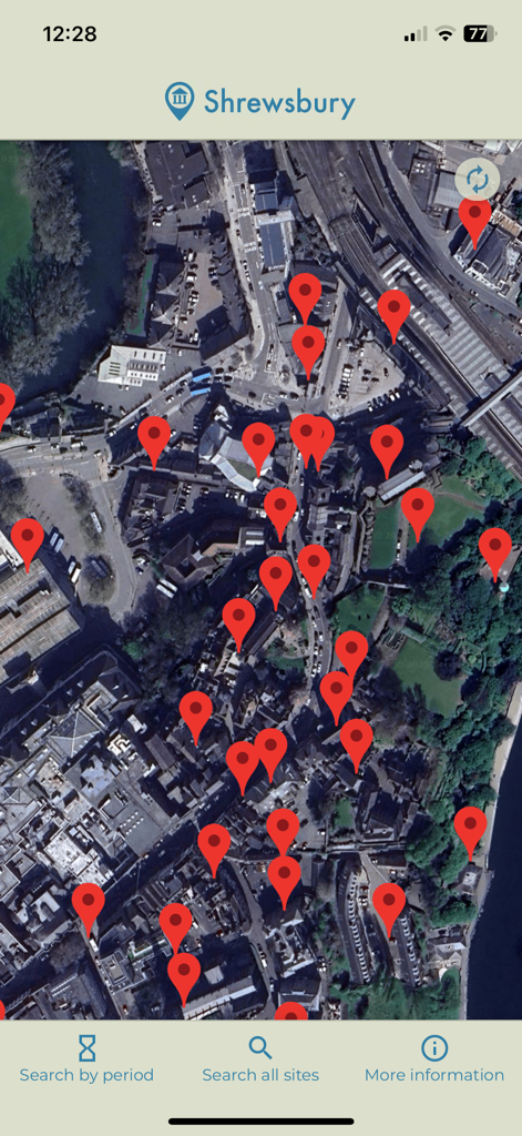 HistoMap Shrewsbury - シュルーズベリーの衛星地図ビュー。多数の遺産・史跡を示す赤いピンが表示されています。
