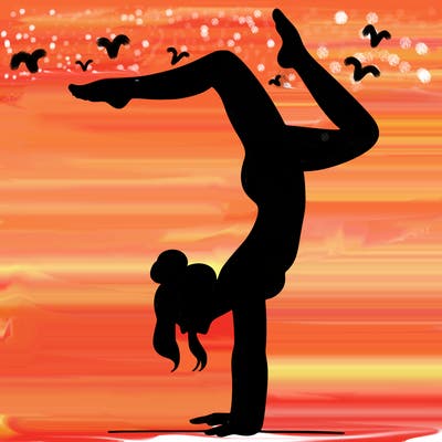 a woman doing a handstand