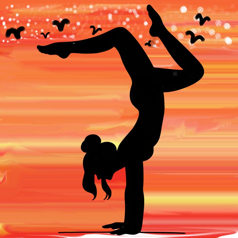 a woman doing a handstand