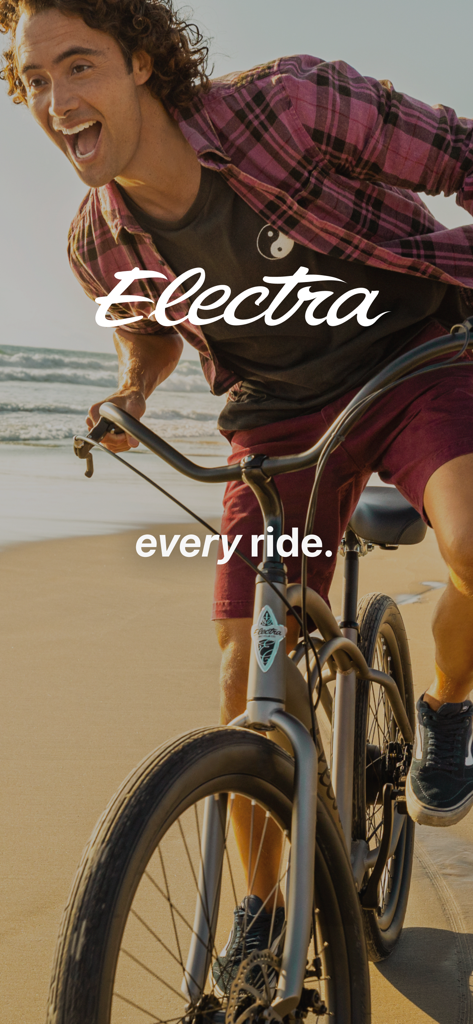Trek Central - A person happily riding an Electra bicycle on a beach.