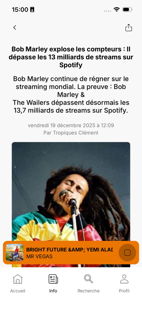 Page d'actualités de l'application Tropiques FM montrant un article sur les records de streaming Spotify de Bob Marley