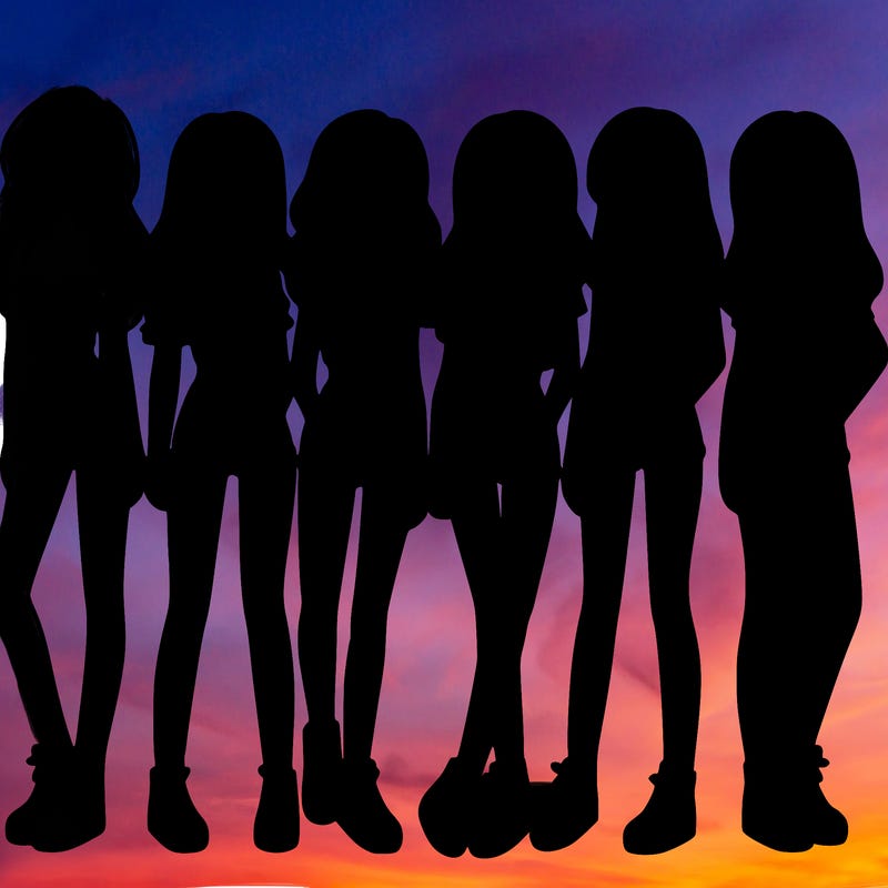 a group of girls wearing crop tops and shorts