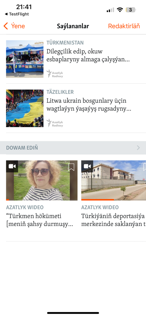 Azatlyk Radiosy - Azatlyk Radiosy mobile app interface showing news headlines and videos in Turkmen language.