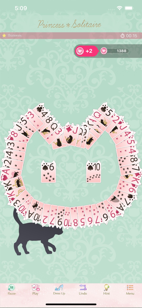 Princess*Solitaire: Cute Games - Princess Solitaire gameplay showing cards arranged in a cat head shape on a mint green background