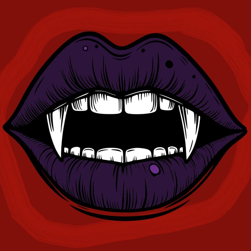 lips with vampire teeth