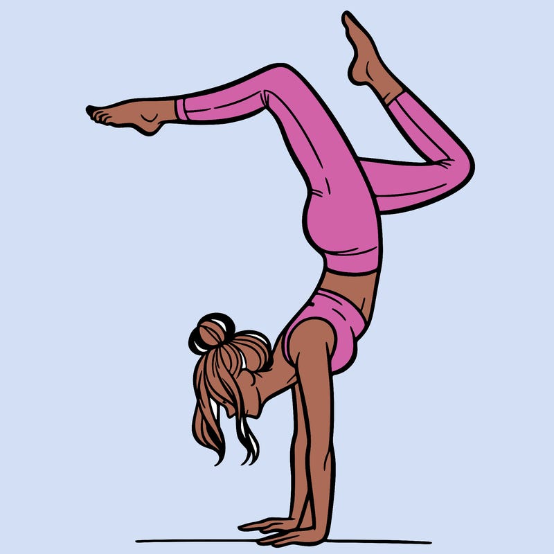 a woman doing a handstand