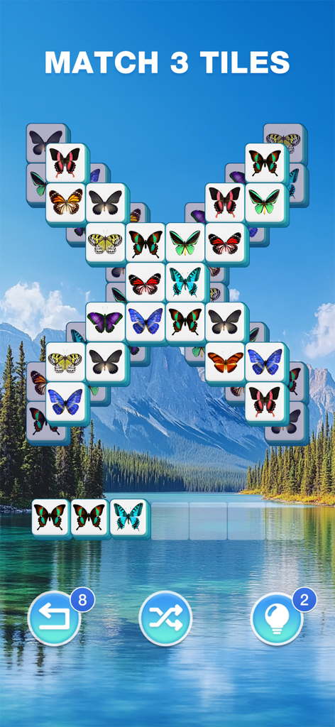 Tile Journey - Classic Puzzle - Jugabilidad de triple combinación de losetas con patrones de mariposas sobre un relajante fondo de lago de montaña