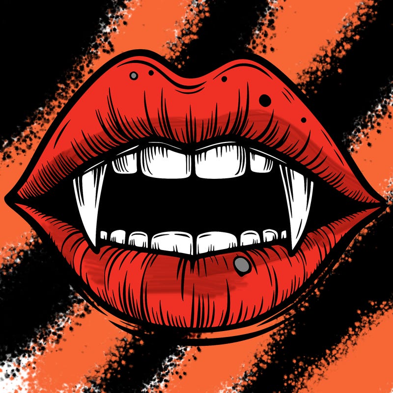 lips with vampire teeth