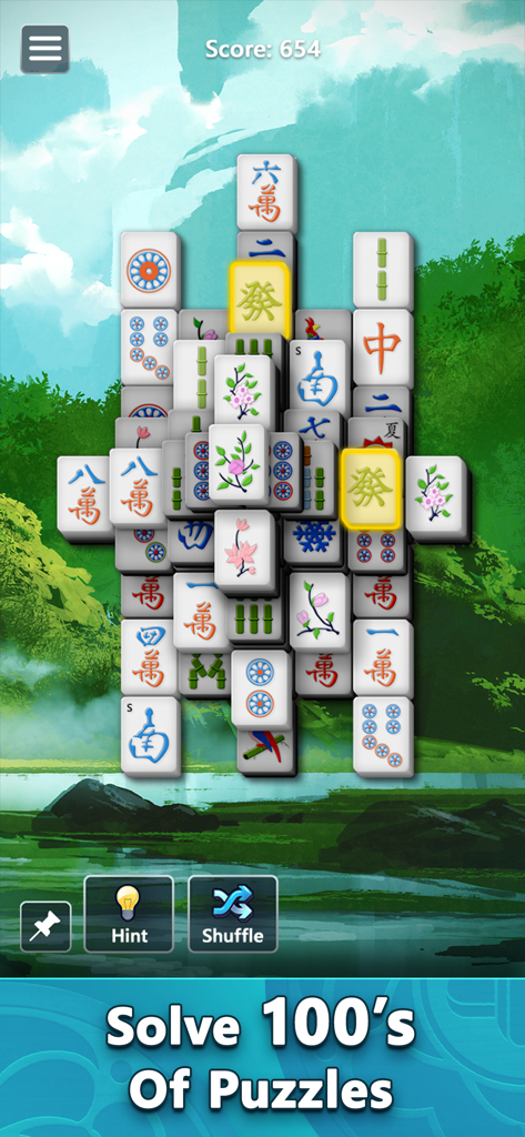 A game of Mahjong by Microsoft showing a tile matching puzzle with a tranquil forest background