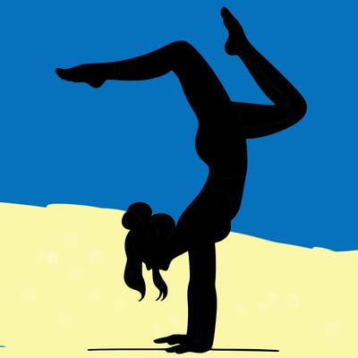 a woman doing a handstand