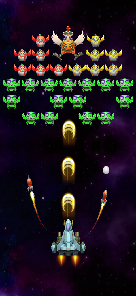 Galaxy Attack: Alien Invaders - A fighter ship shooting yellow projectiles at rows of colorful alien chickens in space.