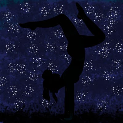 a woman doing a handstand
