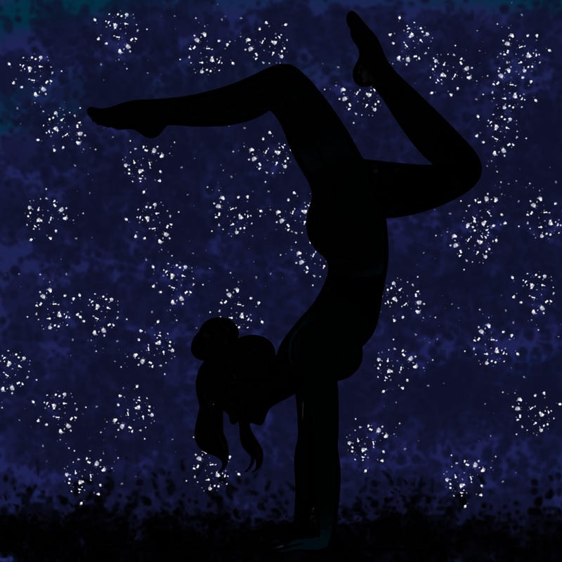 a woman doing a handstand