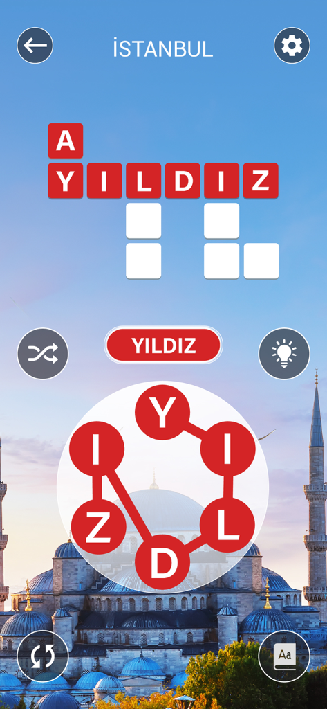 Ein Worträtselspiel-Bildschirm von Kelime Gezmece mit einem Kreuzwortgitter und einem Buchstabenrad vor dem Hintergrund der Stadt Istanbul