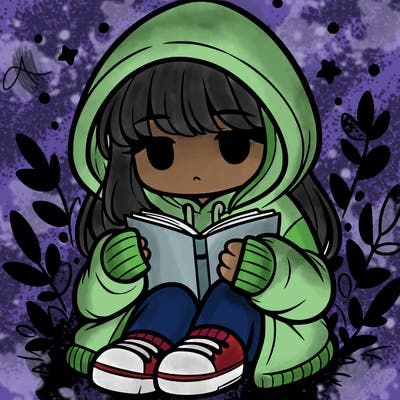 girl in oversized hoodie reading a book