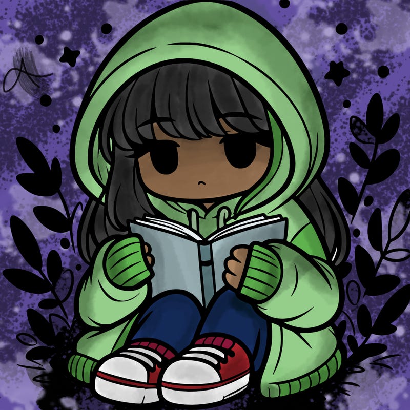 girl in oversized hoodie reading a book