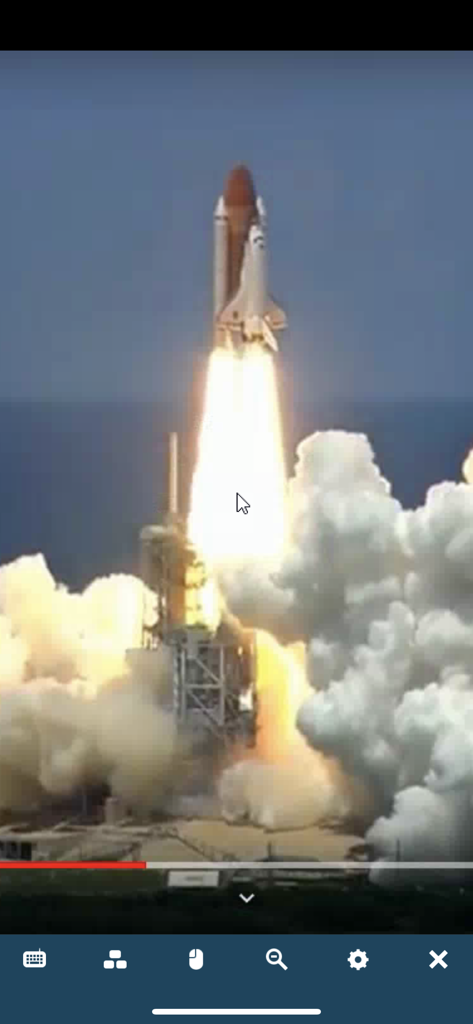 LogMeIn Pro & Central - LogMeIn app interface displaying a high definition video of a space shuttle launch via remote desktop connection.