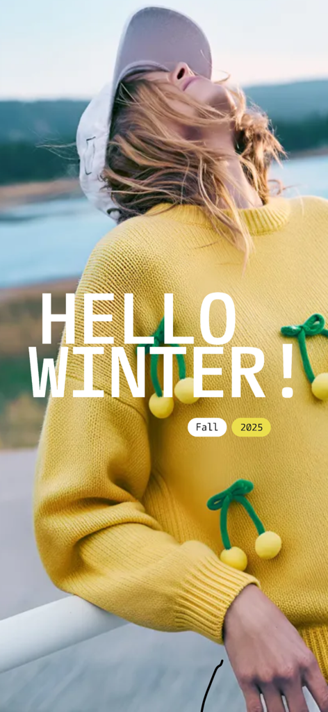 newme - Unleash your style - Une femme portant un pull en tricot jaune vif avec des accents de cerise de la collection d'hiver newme