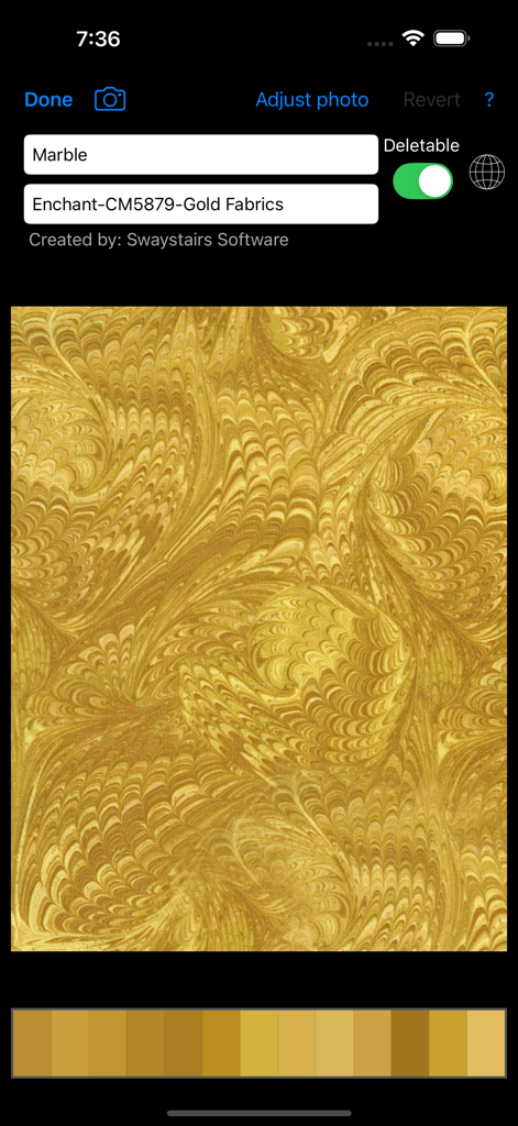 Um padrão de tecido de mármore dourado analisado pelo aplicativo Color Hints mostrando uma paleta de cores amarela correspondente.