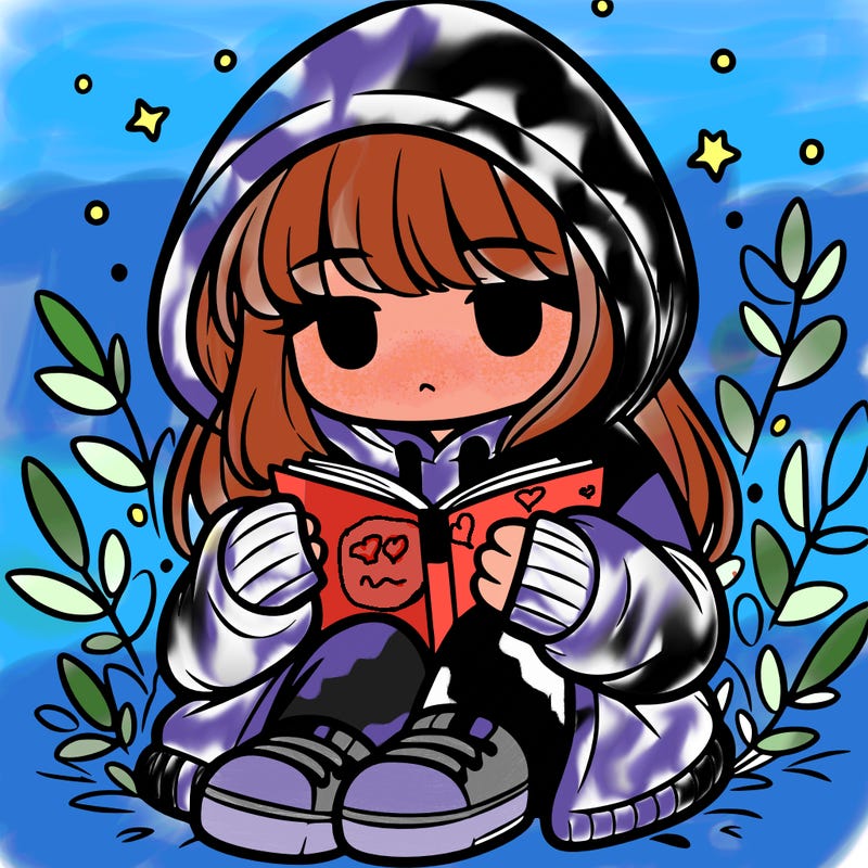 girl in oversized hoodie reading a book