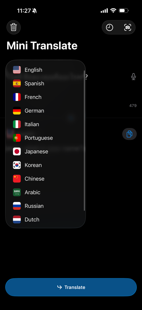 Mini Translate - Offline - A language selection menu in the Mini Translate app showing a list of flags and languages like English, Spanish, and French on a dark background.