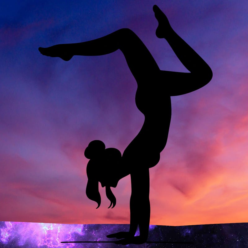 a woman doing a handstand