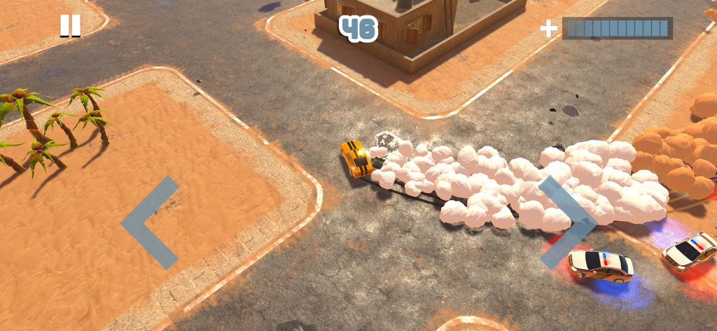 An orange car drifting and leaving a smoke trail while being pursued by police cars in a desert town.