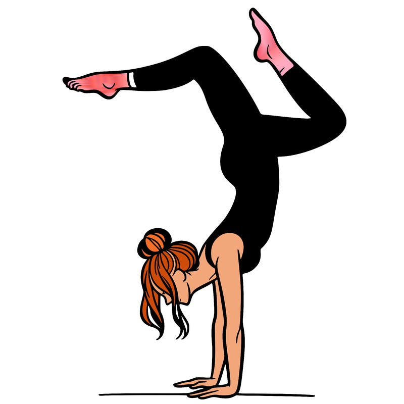 a woman doing a handstand