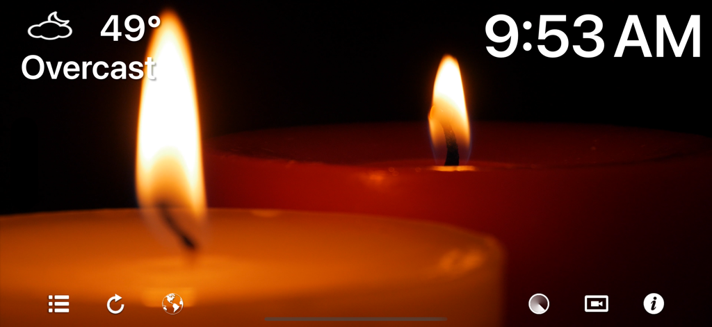 Fireplace 4K - Ultra HD Video - Fireplace 4K app candle theme showing digital clock and weather information