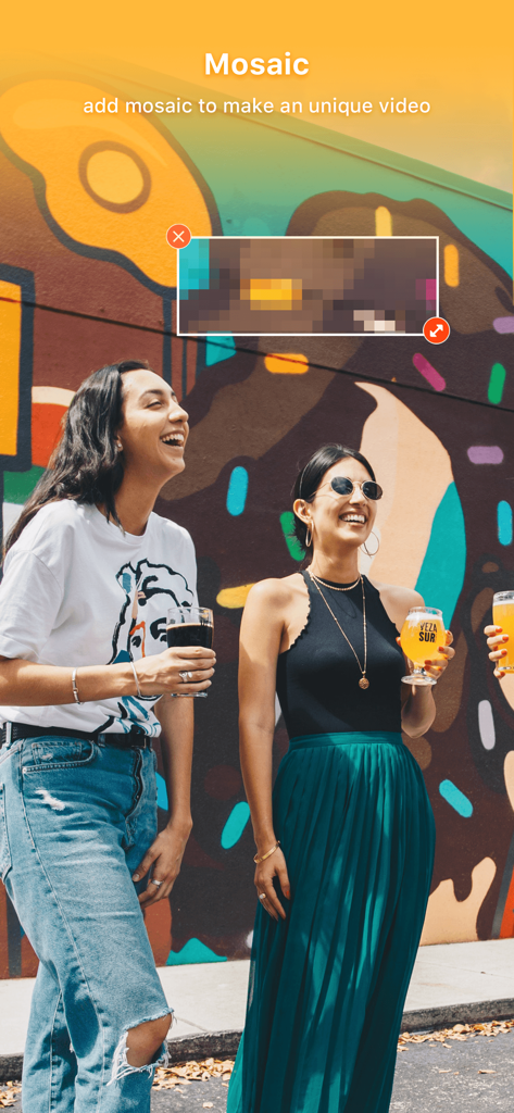 A screenshot of the VideoShow PRO app showing the mosaic tool used to pixelate a portion of a video featuring two women at a colorful mural.