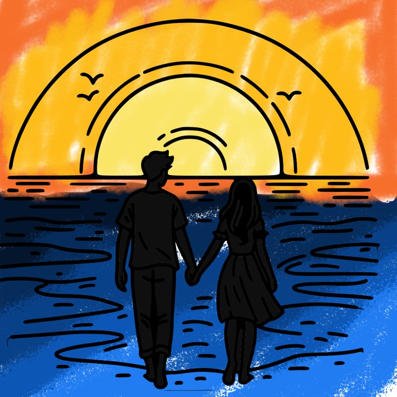 a couple walking on the beach at sun set