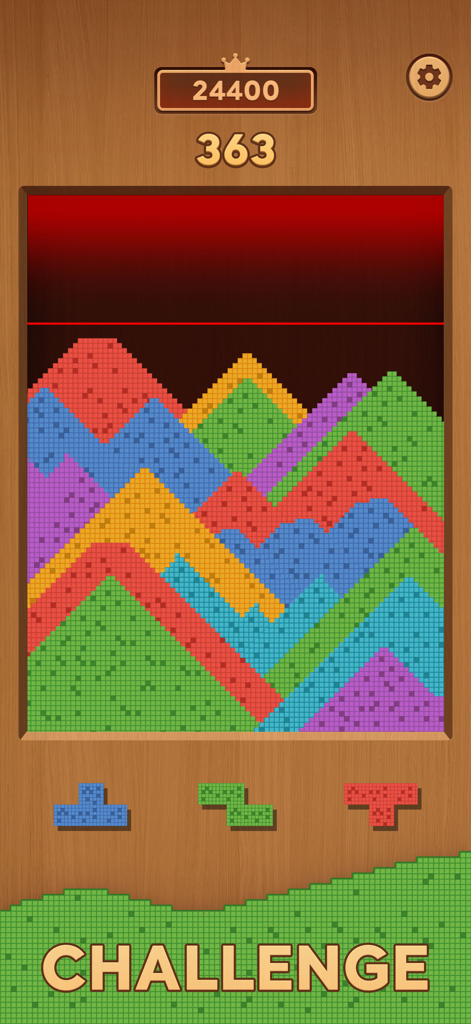 Gameplay screen of Sand Crush showing colorful sand forming mountain shapes