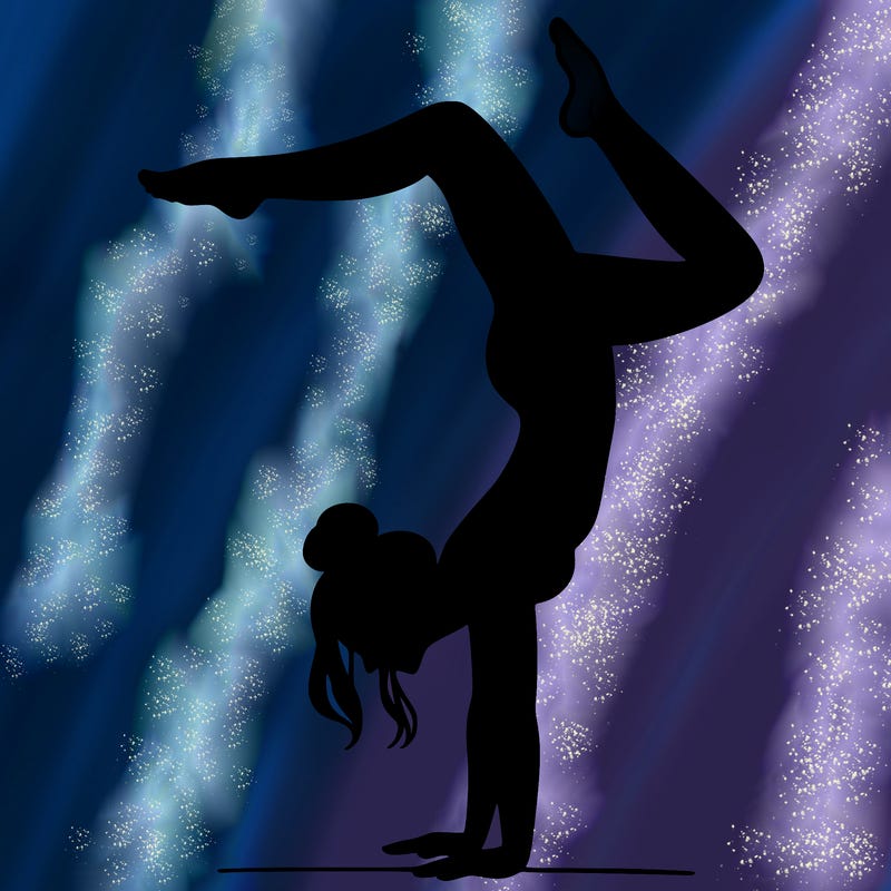 a woman doing a handstand