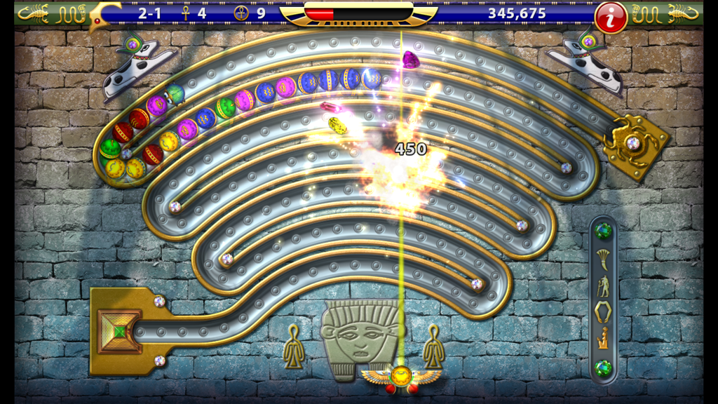 Luxor HD - Gameplay of Luxor HD marble shooter showing colored spheres on a curved track with an Egyptian background