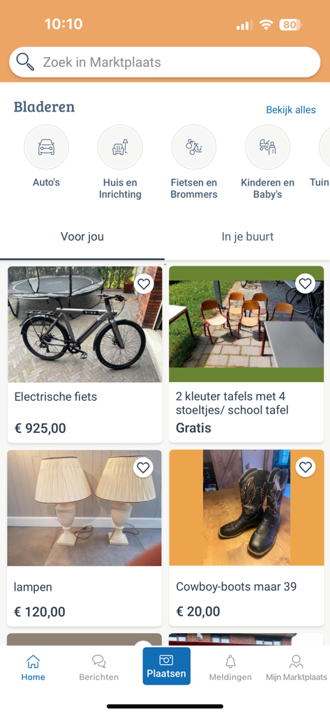 Home screen of the Marktplaats app showing product categories and various second-hand items for sale like a bike and furniture.