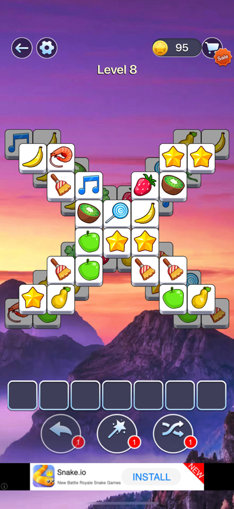 Tile Master Pro: Triple Match - Tela de jogo do Tile Master Pro Triple Match mostrando um tabuleiro de puzzle com peças de frutas e estrelas sobre uma paisagem de montanha ao pôr do sol.