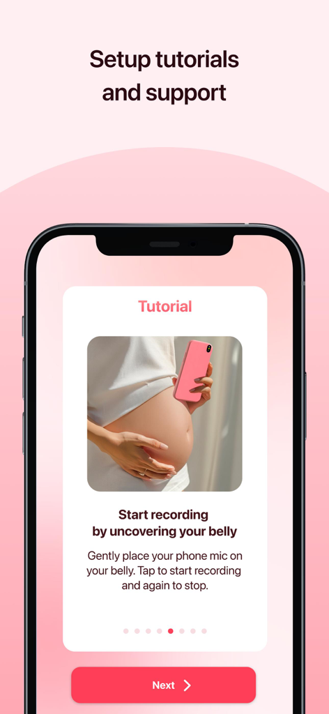 Tutorial screen showing how to record a baby heartbeat by placing the phone on a pregnant belly