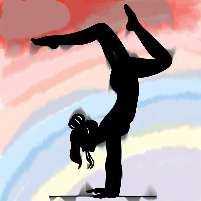 a woman doing a handstand