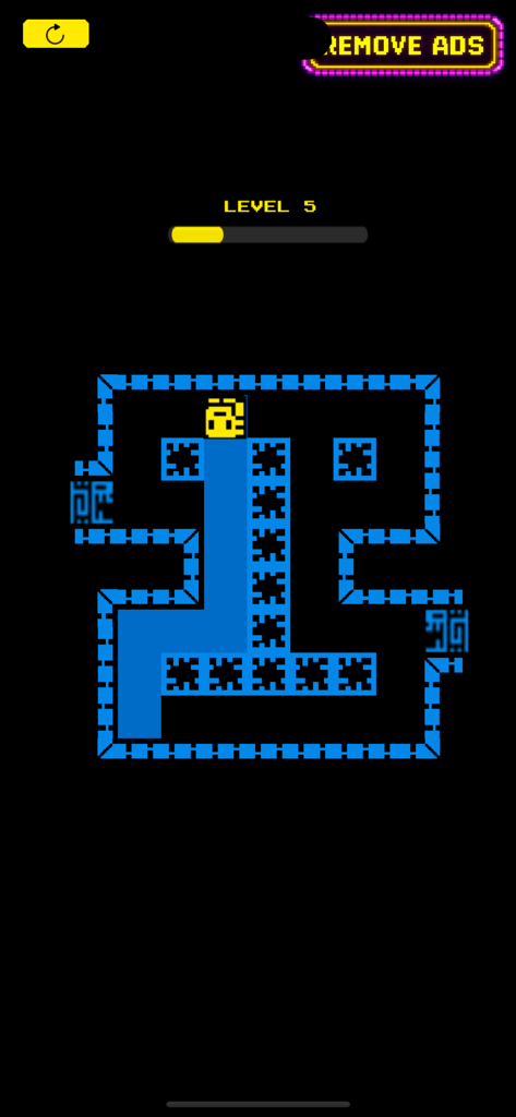 A yellow mask character filling a dark retro maze with blue paint on level five.