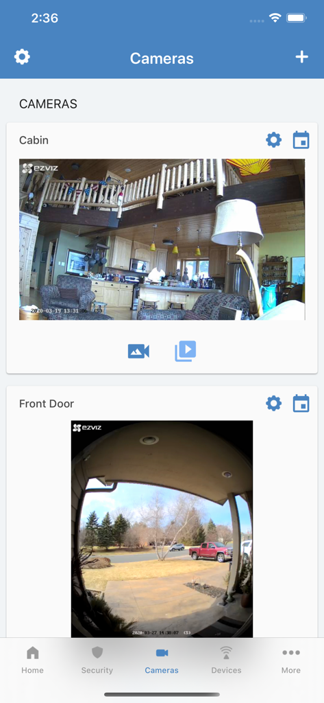 Alula Security app interface showing live camera feeds from a cabin interior and a front door porch