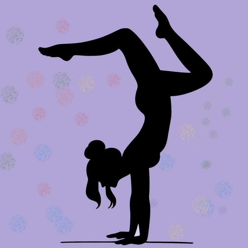 a woman doing a handstand