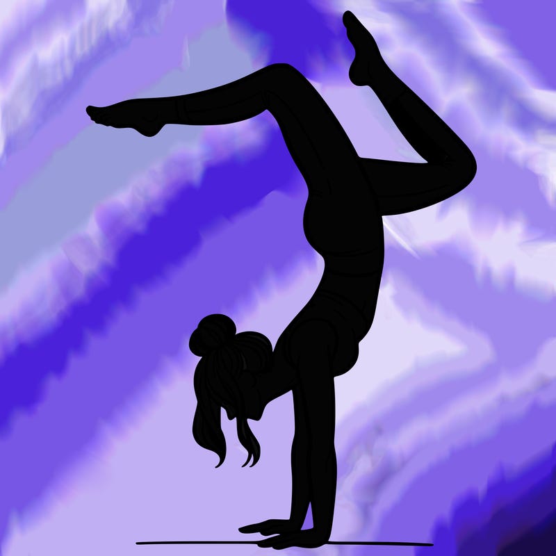 a woman doing a handstand