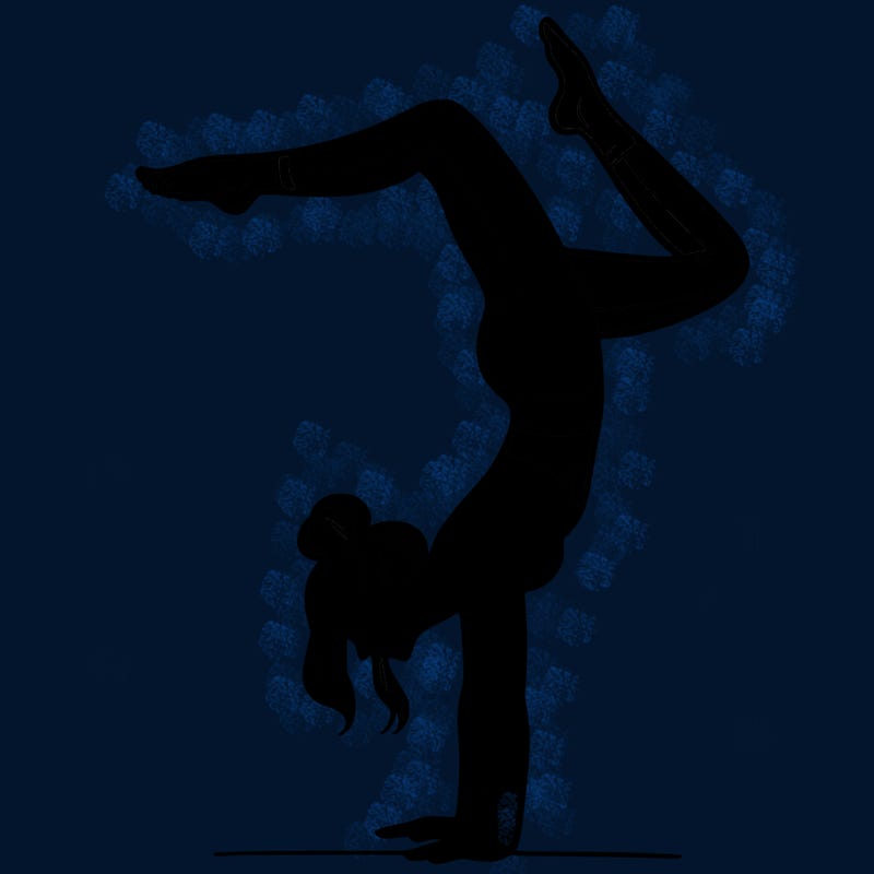 a woman doing a handstand