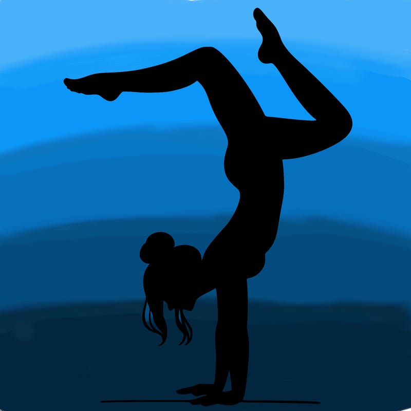 a woman doing a handstand