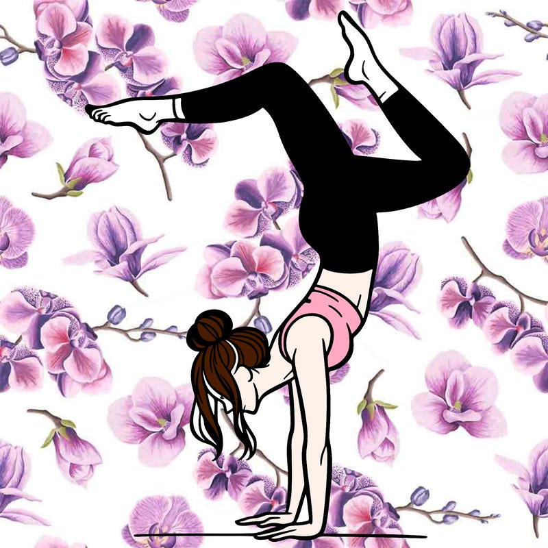 a woman doing a handstand