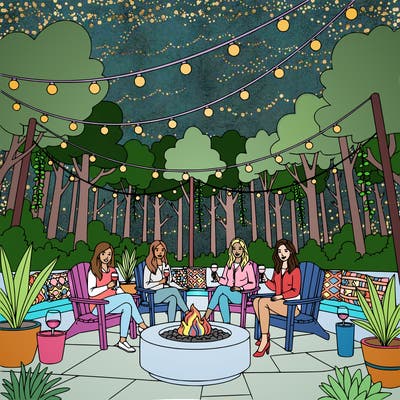 5 women posing for a photo while sitting around a fire pit drinking wine.  include string lights, outdoor decor, nature, etc